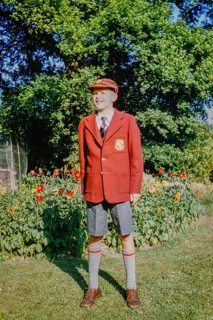 Boy standing in the garden wearing a brand new school uniform, England, Great Britain, 1960s,
