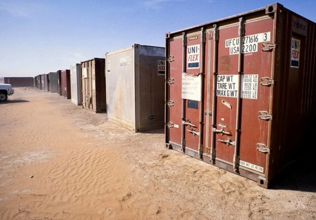 Shipping container with equipment in a storage facility for oil drilling, Dhahran, Arabian Desert,
