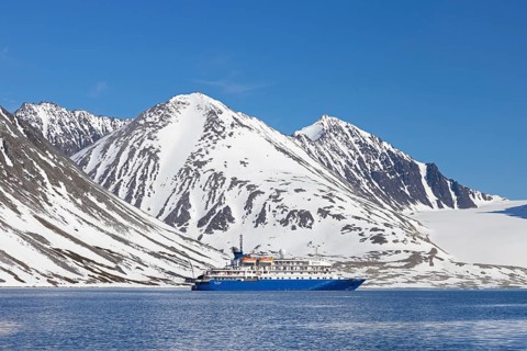 Antarctic cruise ship MV Sea Spirit of Poseidon Expeditions in Magdalenefjorden, fjord in Albert I