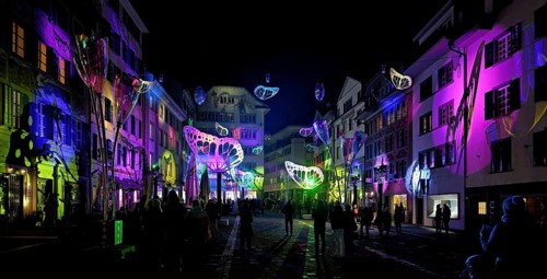 Light installation, on building facades and sculptures in the form of glasses and butterflies in