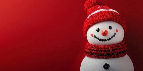 Cute snowman with knitted hat and scarf on red background with copy space. Generative AI, AI