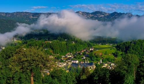 Morning fog over the village of Berchtesgaden in the valley, Berchtesgaden National Park, Upper