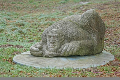 Sculpture Finding by Laura Danzi 2018, stone sculpture, thick, rough, surface, lying, head, face,