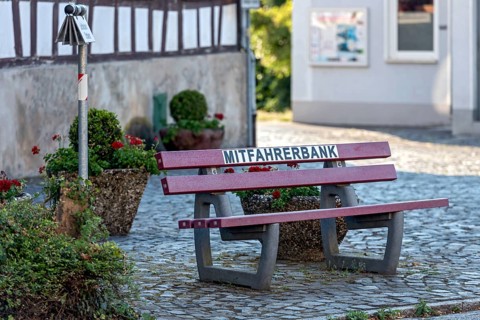 Carpool bench, carpool bench with direction sign for direction of travel, public bench for private