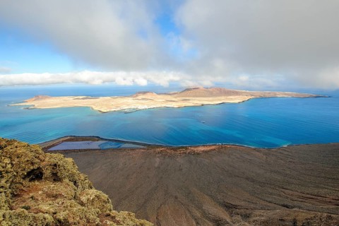 View from Lanzarote to La Graciosa island, largest island in Chinijo archipelago, in between El Rio