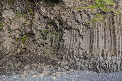 Reynisfjara Beach with Basalt rocks (Stuolabrrg) and the rock needles (Haidrangur), close to Vik i