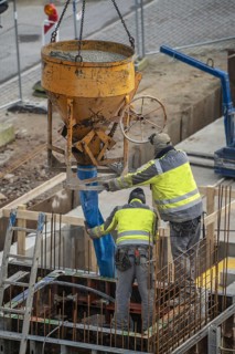 Construction site, concreting, the lift shaft of a building is concreted, the concrete is placed on