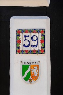 Listed building, mark of the state of North Rhine-Westphalia on a half-timbered house