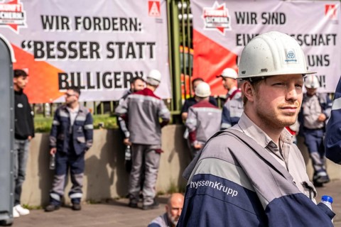 Steelworkers at a demonstration in front of the headquarters of ThyssenKrupp Steel Europe in