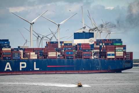 Entrance to the seaport of Rotterdam, APL Raffles container freighter, entering Maasvlakte 2, wind