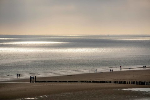 Evening mood on the North Sea beach near Zoutelande, Zeeland, anglers, walkers, breakwater,