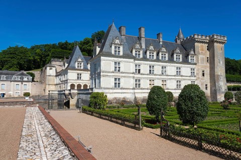 Historic stone castle with manicured green garden on a sunny day, Villandry Castle, Renaissance,