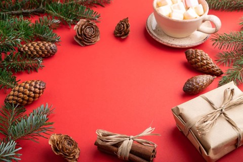 Christmas or New Year frame composition. Decorations, box, cinnamon, cones, fir and spruce