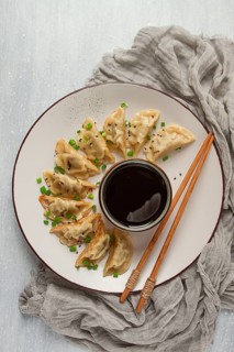 Japanese Gyoza dumplings, fried, with sauce, top view, without people, tinted, selective focus