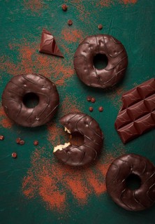 Donuts with cocoa, in chocolate glaze, top view, no people