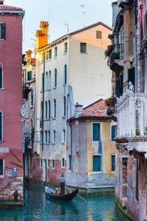 Gondola with tourists in the side canal of the old town, old building, city trip, holiday, travel,