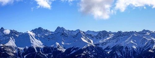 Alpine panorama with snow-covered mountain peaks in winter. Taken in the ski resort of Serfaus Fiss