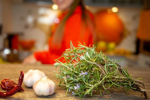Vegan cooking: Close-up of rosemary, garlic cloves and chilli peppers