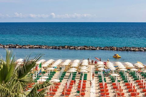 Beach with sunbeds and parasols on the Mediterranean in Sanremo, beach life, San Remo, Imperia,