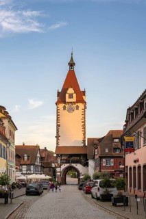 View across the main street to the Kinzigtor, historic town tower and landmark in the old town