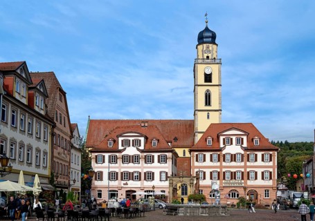 The twin houses built in the early classicist style with church tower on the market square in the