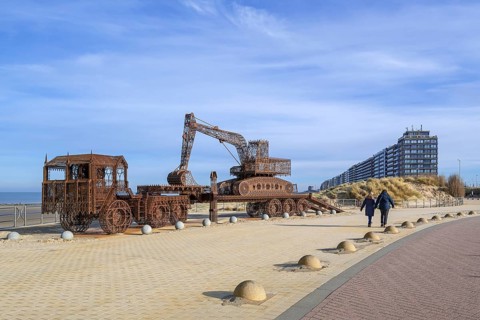 Caterpillar + Flatbed Trailer, artwork by Belgian neo-conceptual artist Wim Delvoye at seaside