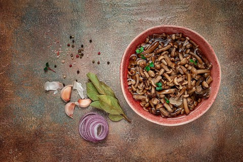 Pickled honey mushrooms, in a bowl, homemade, top view, no people