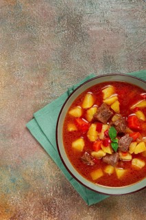 Meat goulash, with potatoes and carrots, sweet pepper, traditional Hungarian soup, homemade, no