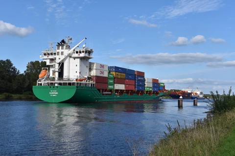 Container ship Elbspring travelling through the siding in the Kiel Canal, Schleswig-Holstein,