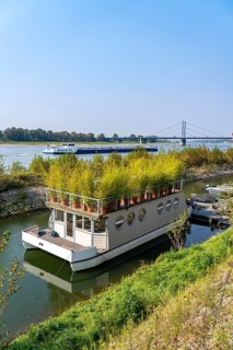 Houseboat with roof garden at the Rhine harbour on Robert-Lehr-Ufer, in Düsseldorf, in the