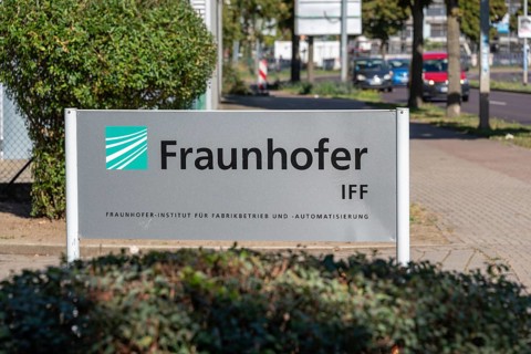 Sign with the inscription Fraunhofer IFF at the entrance to the Fraunhofer Institute for Factory