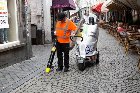 Street cleaner using vacuum machine, Maastricht, Limburg province, Netherlands