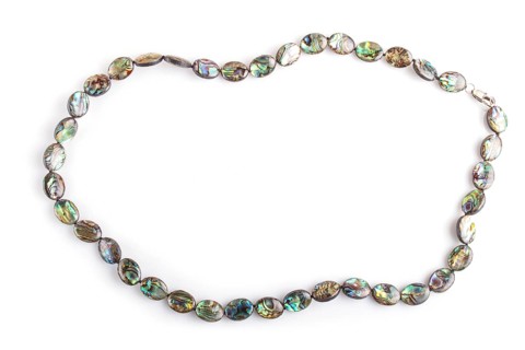 Colored nacre beads isolated on white background. top view, close up. mother-of-pearl