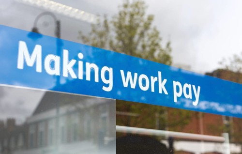 Making Work Pay banner in window of Jobcentre Plus office, Department for Work and Pensions,