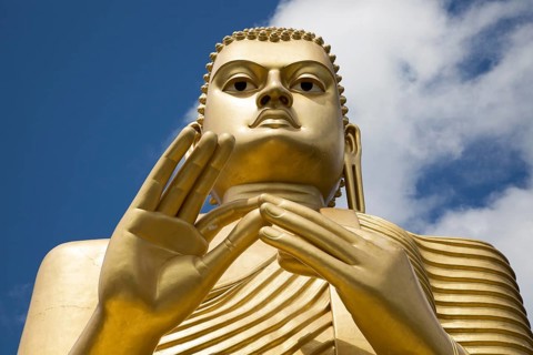 Giant Golden Buddha statue at Dambulla cave temple complex, Sri Lanka, Asia