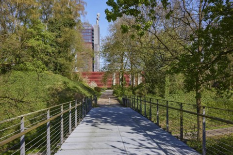 Tower of Nordstern colliery with the statue of Hercules from the Tausendfüsserbrücke bridge in