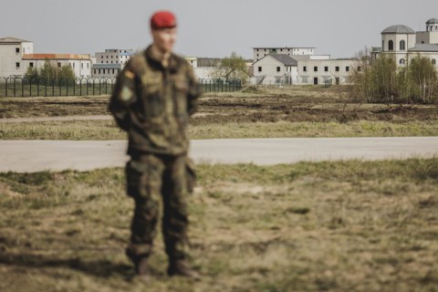 A soldier stands out in front of the training town, taken as part of a Bundeswehr exercise with