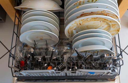 Dishwasher, full of dirty crockery