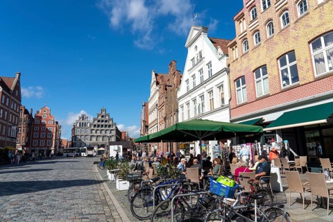The old town centre of Lüneburg, central square Am Sande, with medieval gabled houses, building of