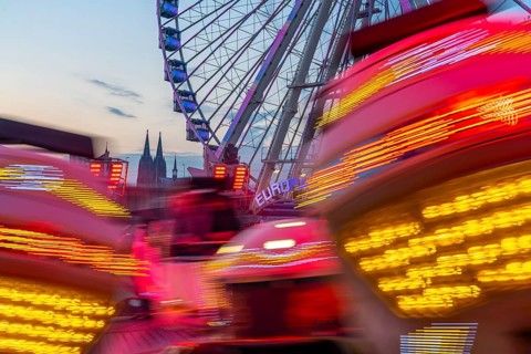 Deutz funfair on the Rhine, at Easter, funfair, break-dancer ride, Ferris wheel, Cologne Cathedral,