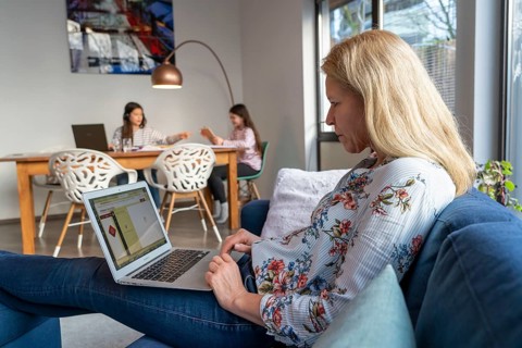 Homeschooling, during the lockdown in January 2021, children learning at home for school, a girl in