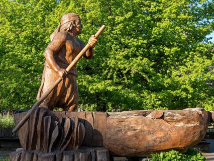 Wooden sculpture of man in a boat, central plaza, plaza de armas, Pucon, La Auracania, Chile, South