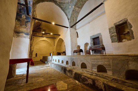 Interior of an old church in the Greek monastery with brick arches and an altar, Inside the