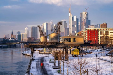 The skyline of Frankfurt am Main, skyscrapers of the banking district, historic harbour cranes at