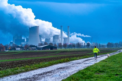 Field path, woman walking her dog, lignite-fired power plant, RWE Power AG Niederaußem power plant,
