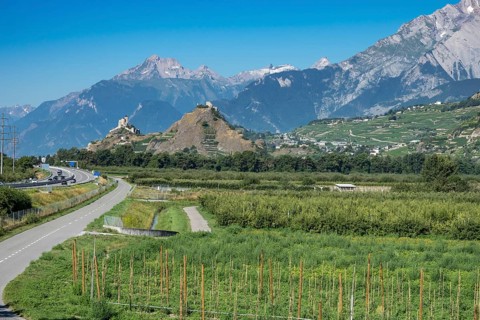 View over vineyards to castles of Sierre and Sion in the Rhone valley, Rhone highway A9 to the