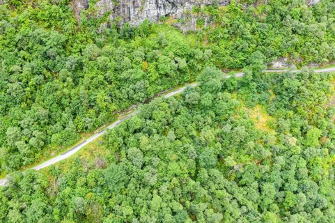 Aerial view of road above lake Lovatnet (or: Loenvatnet), valley Lodalen south of village Loen,