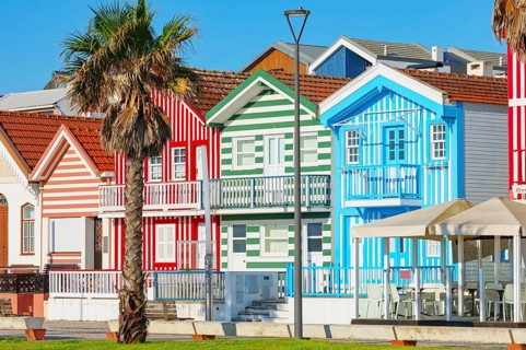 Brightly painted beach homes, Costa Nova do Prado, Aveiro, Portugal, Europe