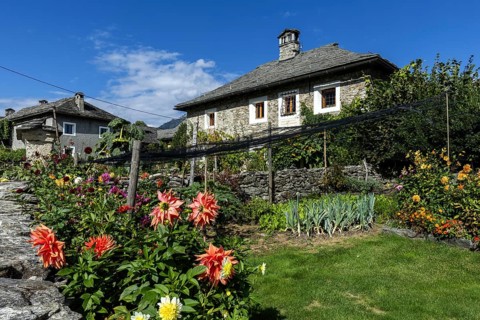 View of the village, typical Ticino stone houses in the mountain village of Rasa, Centovalli,