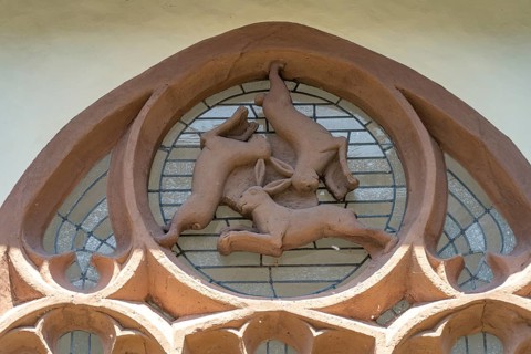 Three-hare window in the inner courtyard of Paderborn Cathedral, Paderborn, North Rhine-Westphalia,